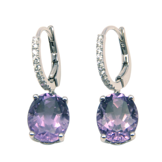 Beautiful amethyst earrings feature in four claw setting and diamond pave-set in a drop design of 14K white gold.